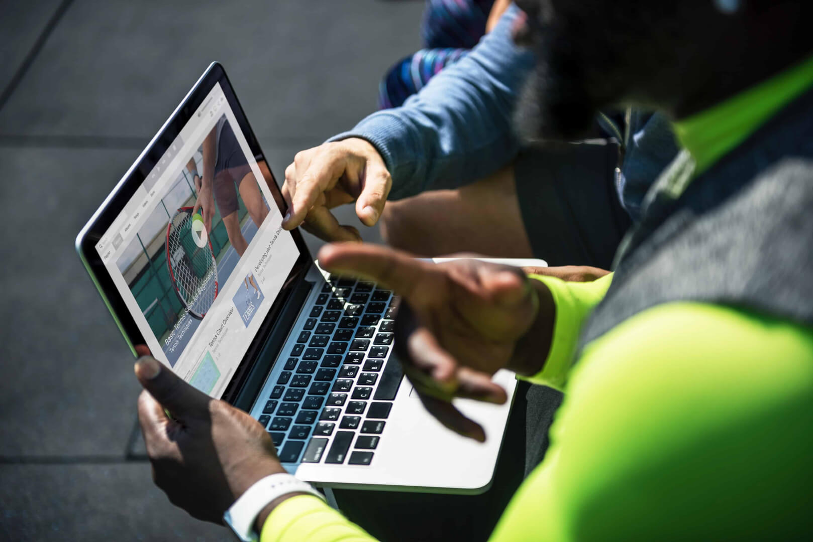 Two people watching a video marketing ad