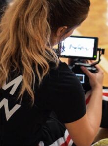 woman filming sports event