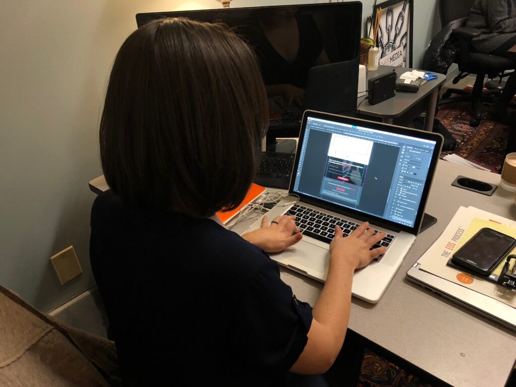 Hughes Media Team editing photos for social media use